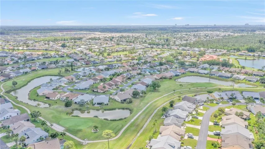 Bird's eye view featuring a residential view, a water view, and view of golf course