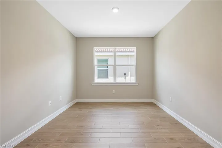 Empty room with light wood-type flooring