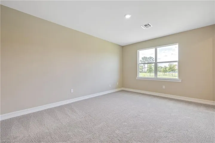 Unfurnished room featuring carpet