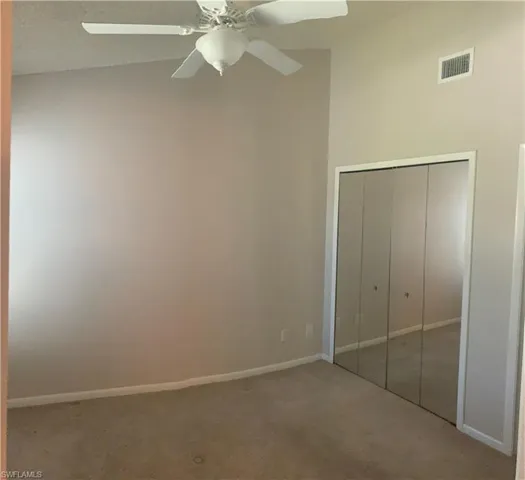 3rd bedroom located upstairs featuring ceiling fan, and acloset with private bathroom l