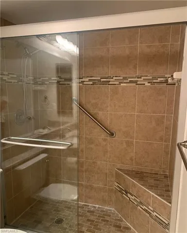 Master Bathroom featuring a shower with door