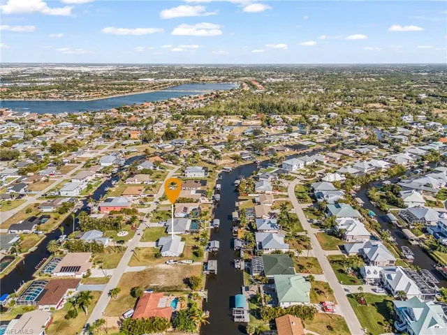 Aerial perspective of suburban area with a large body of water