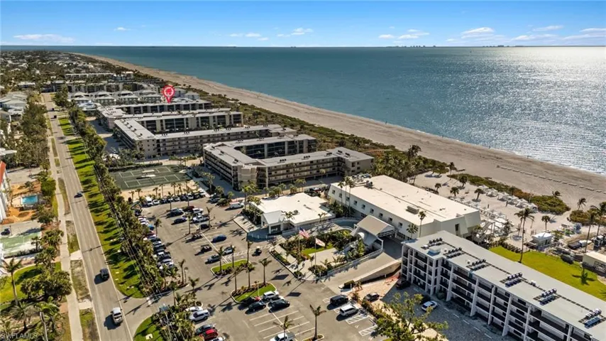 Aerial view of expansive beach and apartment complex