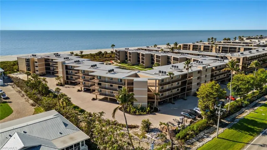Aerial view of apartment complex and a large body of water