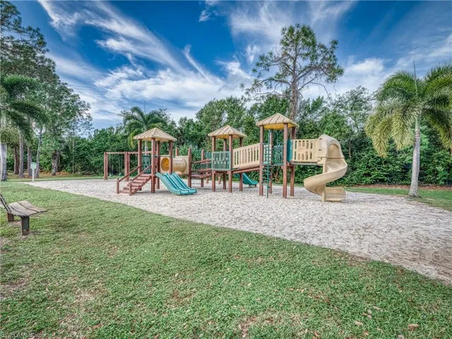 Community playground featuring a lawn