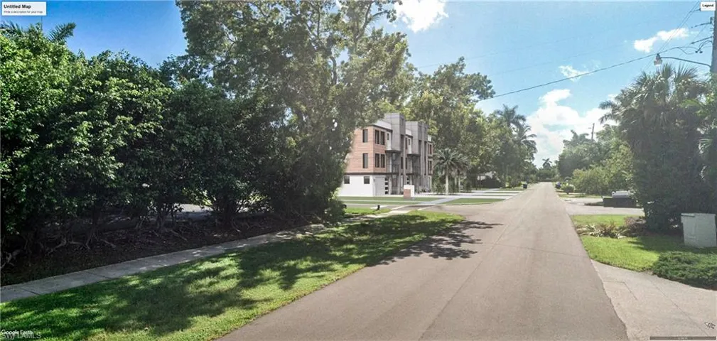 View of asphalt street featuring sidewalks