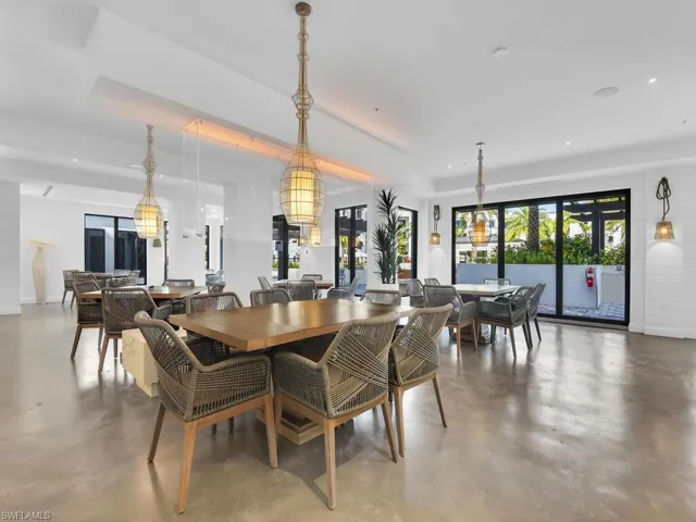 Dining space featuring finished concrete flooring and recessed lighting