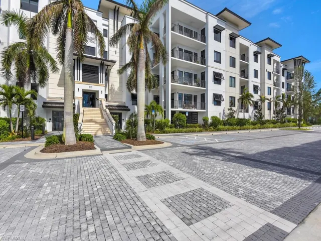 View of apartment building / complex featuring stairs