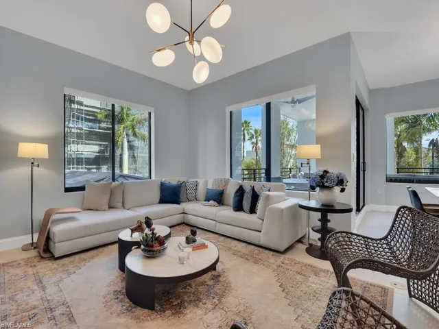 Living area featuring healthy amount of natural light and suspended lighting