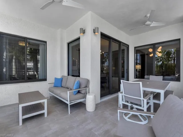 View of patio with ceiling fan and outdoor lounge area