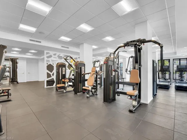 Workout area featuring a drop ceiling