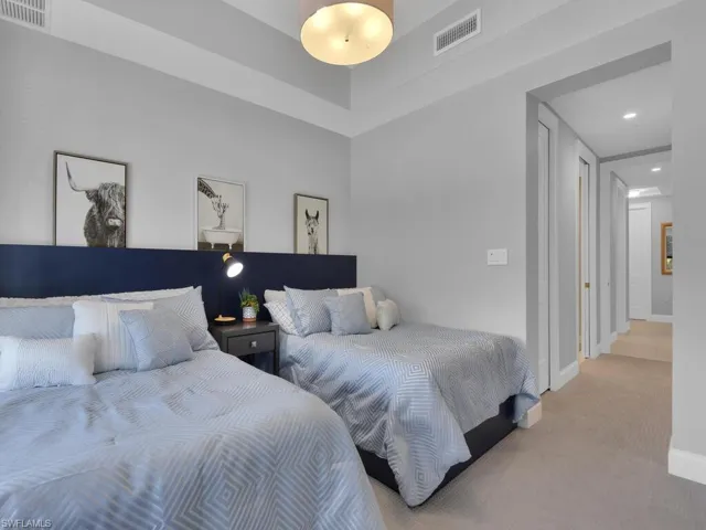 Carpeted bedroom featuring baseboards and recessed lighting