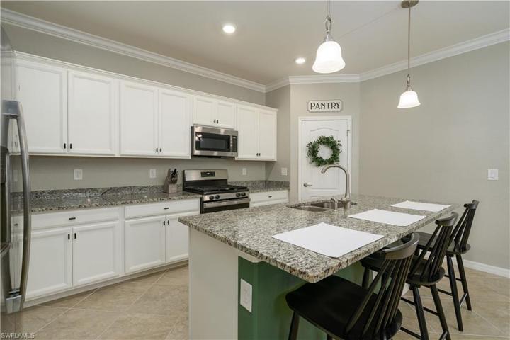 Beautiful White Cabinets with stainless appliances, and a gas stove too!
