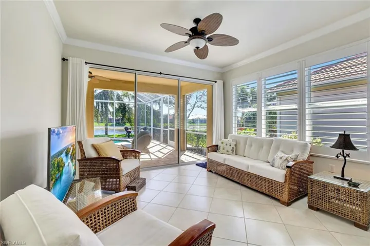 Sunroom featuring a healthy amount of sunlight and ceiling fan