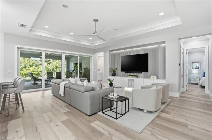 Open living overlooking the elegant garden and preserve.