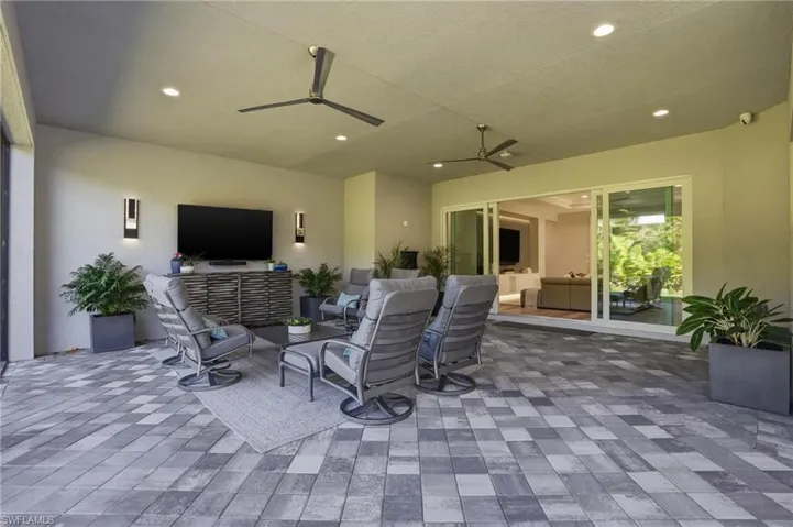 Large outdoor lanai with entertainment area.