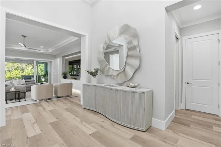 Right away, notice the tasteful decor and stunning wide plank hardwood floors.