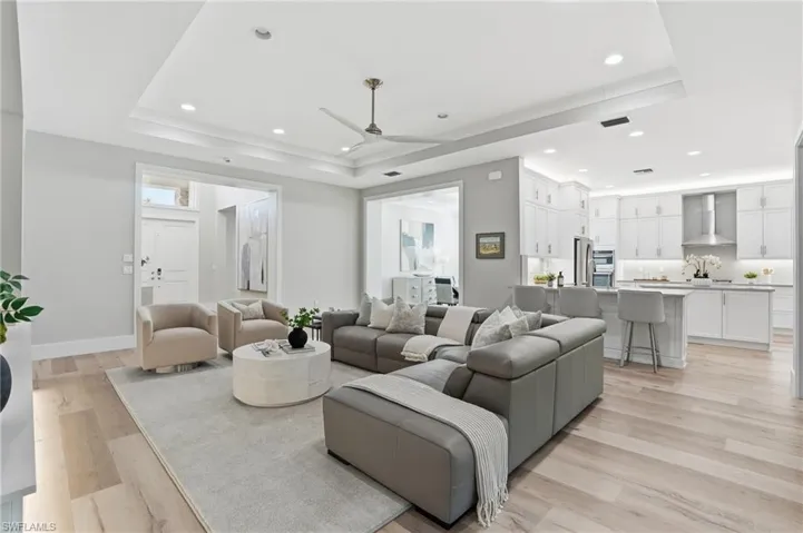 Ten foot high ceilings and the coffer ceiling makes it 11 feet high with abundant  recessed lights and large ceiling fan.
