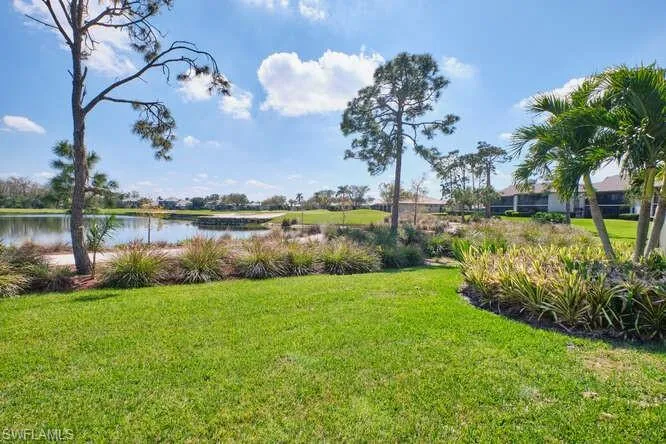 View of yard with a water view