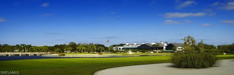 View of property's community with a lawn