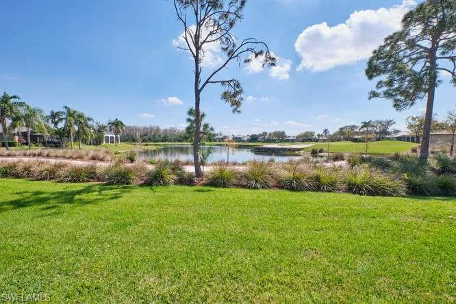View of yard with a water view