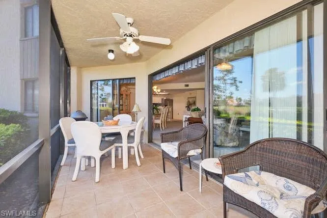 Sunroom / solarium with plenty of natural light and a ceiling fan