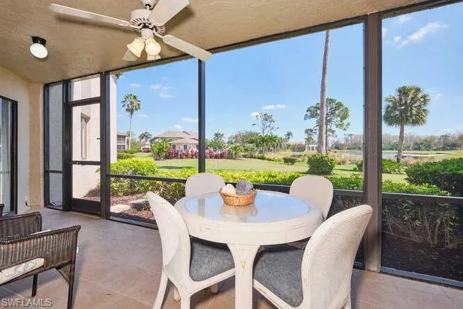 Sunroom featuring ceiling fan