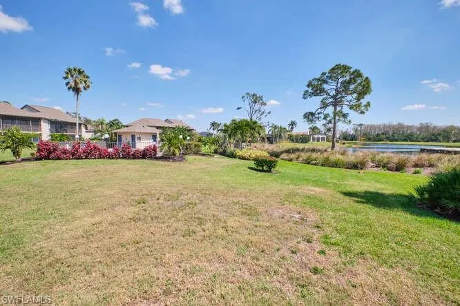 View of yard with a water view