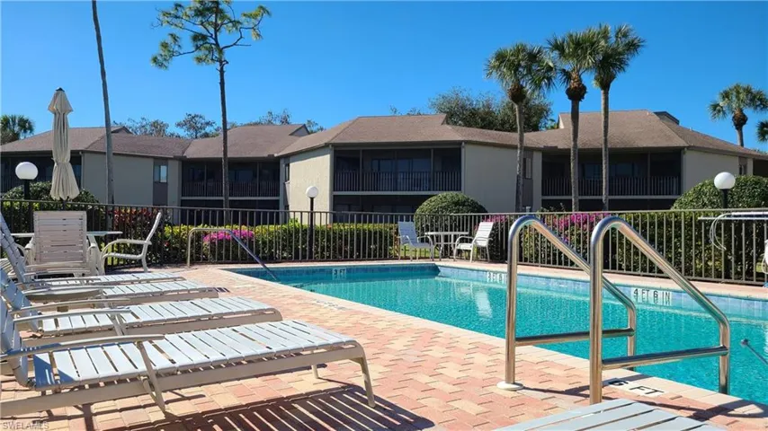 Pool featuring a patio area and fence