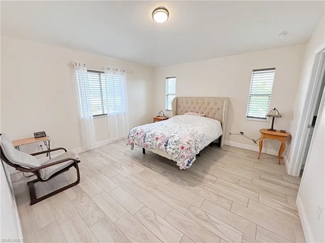 Primary Bathroom with double vanity and a walk in shower