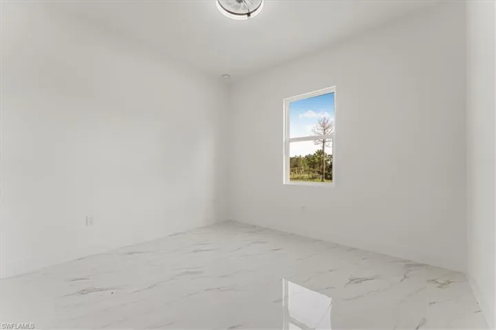 Unfurnished room with marble finish flooring