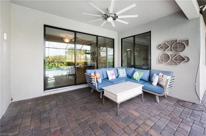 View of patio featuring ceiling fan and an outdoor hangout area