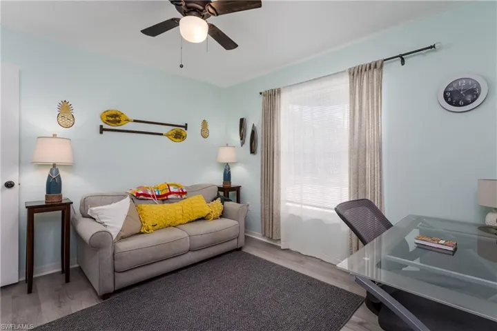 Office area featuring wood finished floors and ceiling fan