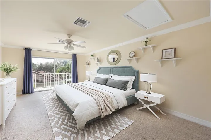 Upstairs room with closet & balcony  with ceiling fan, access to outside, and ornamental molding
