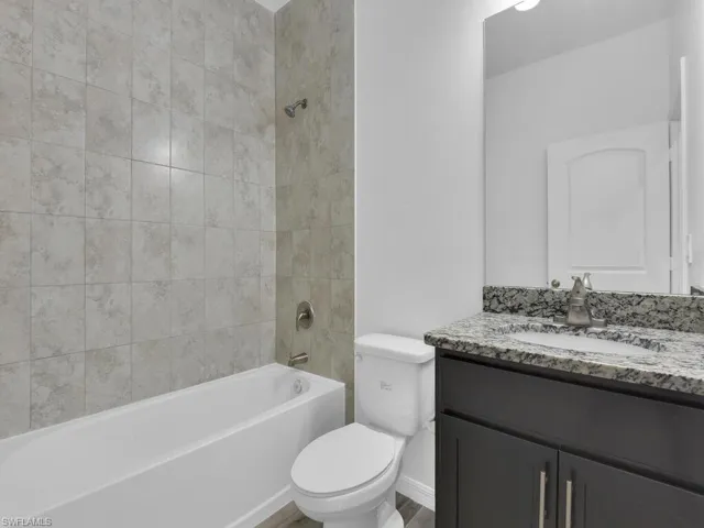 Full bath with vanity and shower / bathtub combination