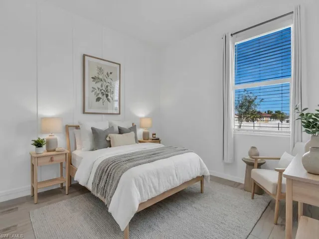 Bedroom with light wood-style flooring and baseboards
