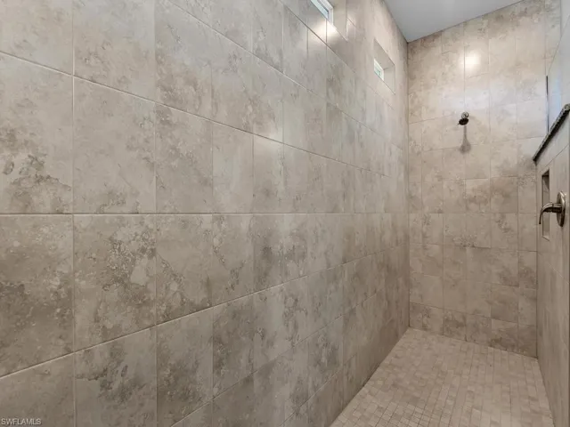 Bathroom with tiled shower