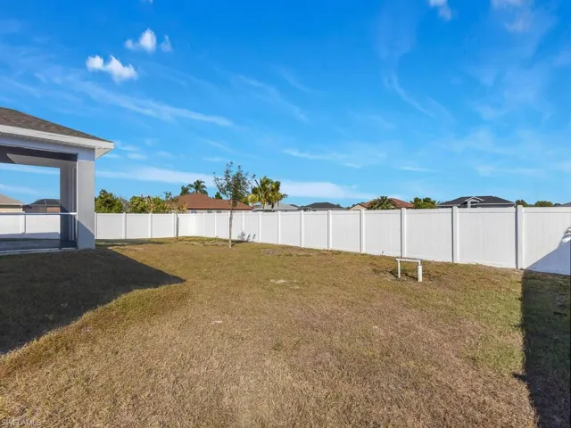 View of fenced backyard