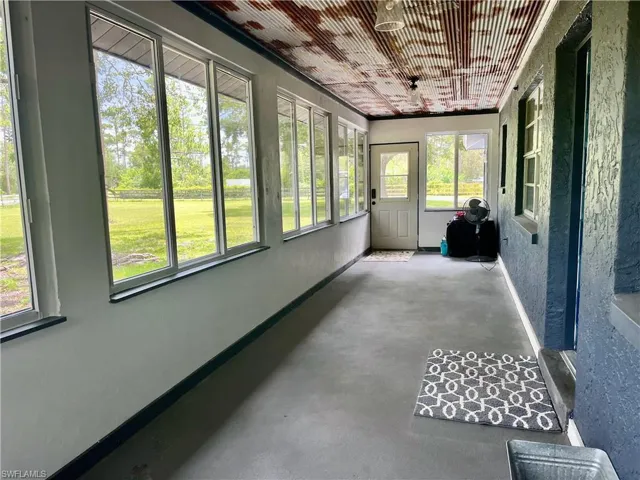 Front porch- impact windows with screens