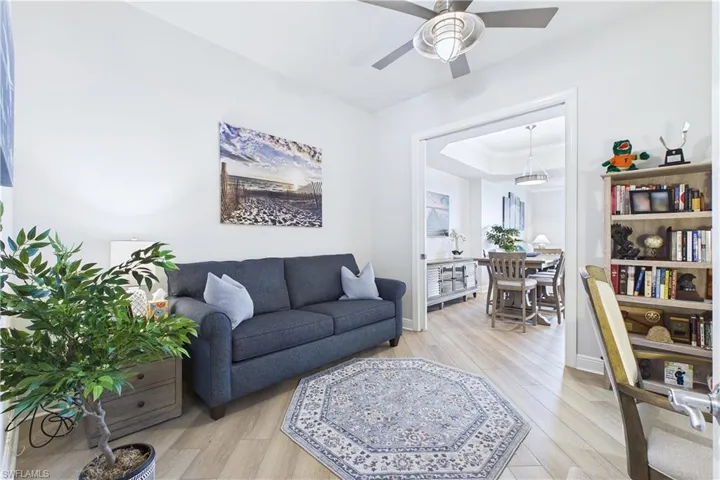 Living room featuring light wood-style floors and ceiling fan