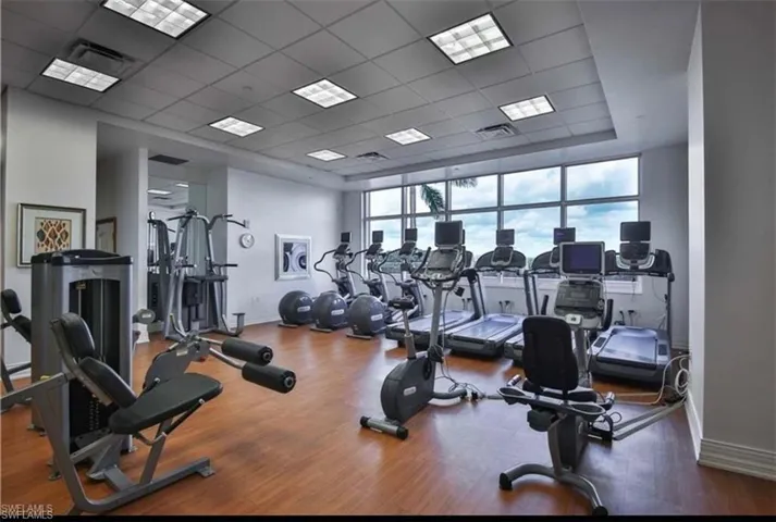 Gym with a paneled ceiling