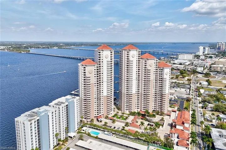 View of urban area featuring a large body of water and a notable bridge