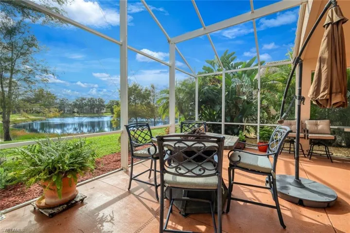Sunroom featuring a water view