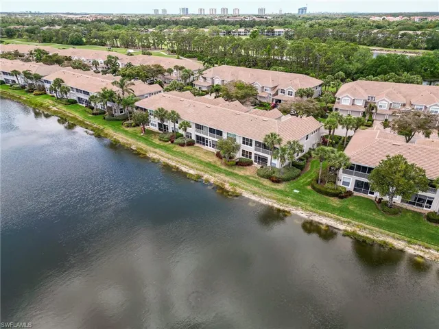 Aerial view with a water view and a residential view