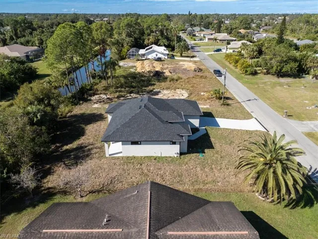 Aerial perspective of suburban area with a large body of water