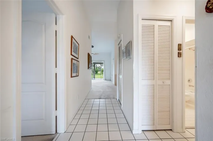 Hall with light tile patterned floors