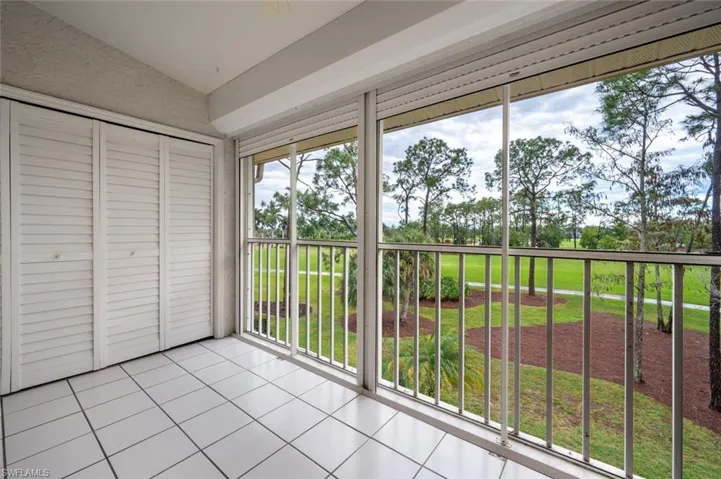 Unfurnished sunroom with vaulted ceiling