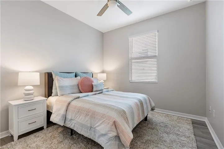 Guest Bedroom with closet and ceiling fan