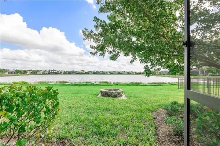 View of yard featuring a fire pit and a water view