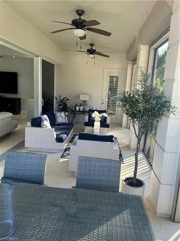 Lanai with ceiling fan and an outdoor living space